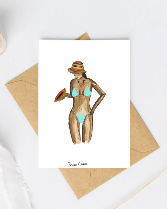 Carte postale fille en bikini papaye a la main